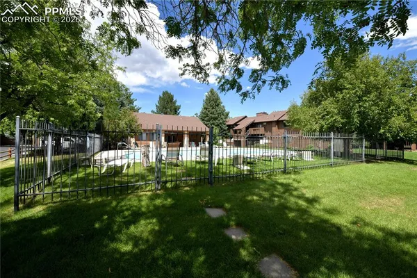 a view of a house with backyard porch and sitting area