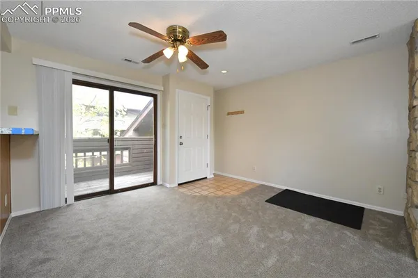 a view of an empty room with a window