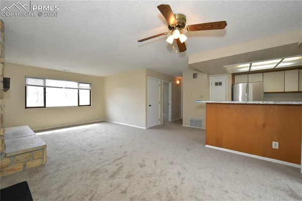 a view of an empty room with a window