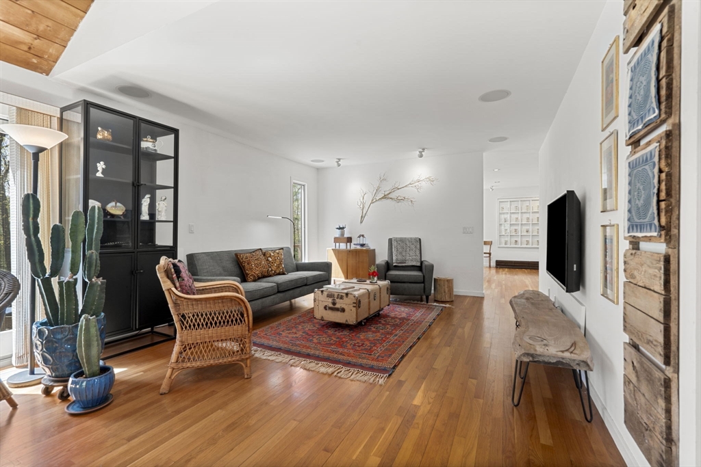 11 Chaplin Road Boxford, MA 01921 - Photo 18 of 42 a living room with furniture and a flat screen tv