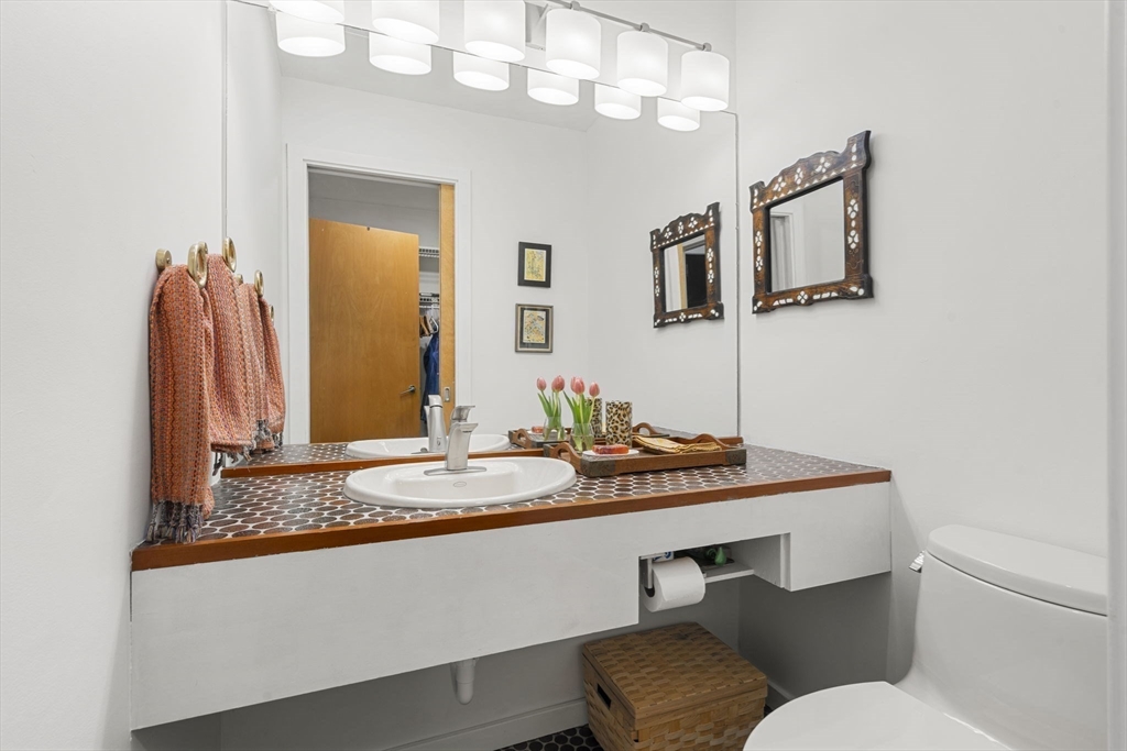 11 Chaplin Road Boxford, MA 01921 - Photo 20 of 42 a bathroom with a granite countertop sink and a mirror
