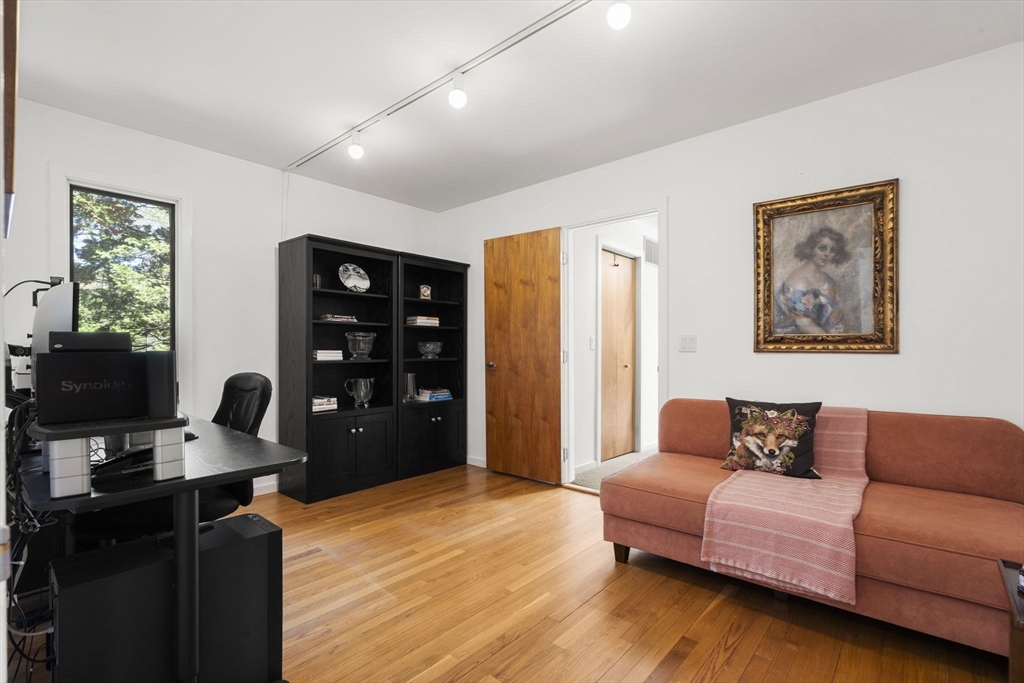 11 Chaplin Road Boxford, MA 01921 - Photo 21 of 42 a bedroom with a bed furniture and a flat screen tv