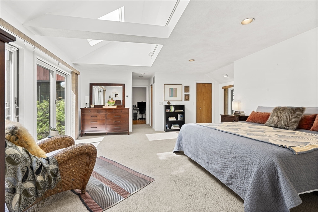 11 Chaplin Road Boxford, MA 01921 - Photo 22 of 42 a spacious bedroom with a bed and glass window