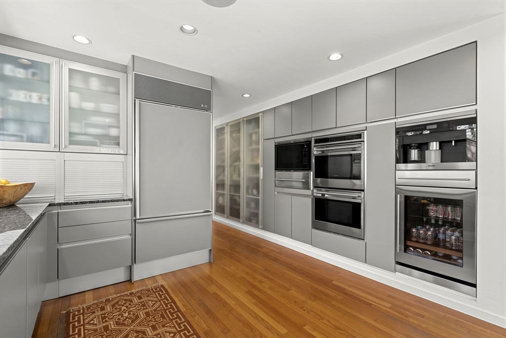 11 Chaplin Road Boxford, MA 01921 - Photo 10 of 42 a kitchen with stainless steel appliances kitchen island granite countertop a refrigerator and a stove top oven