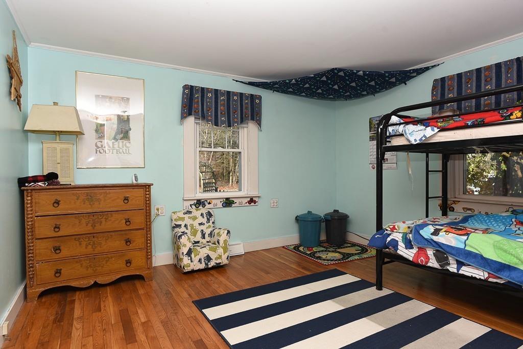 156 Indian Neck Road Wareham, MA 02571 - Photo 11 of 18 a bedroom with a bed and a window