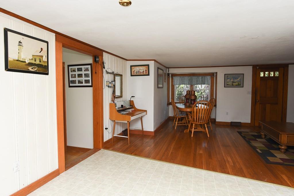 156 Indian Neck Road Wareham, MA 02571 - Photo 4 of 18 a dining room with furniture and a floor to ceiling window