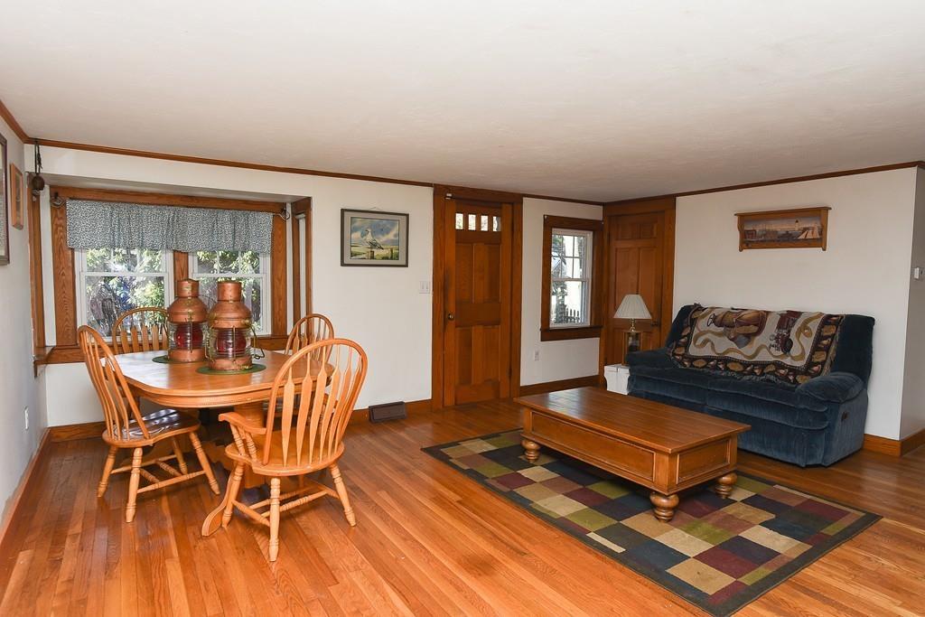 156 Indian Neck Road Wareham, MA 02571 - Photo 5 of 18 a living room with furniture a table and a window