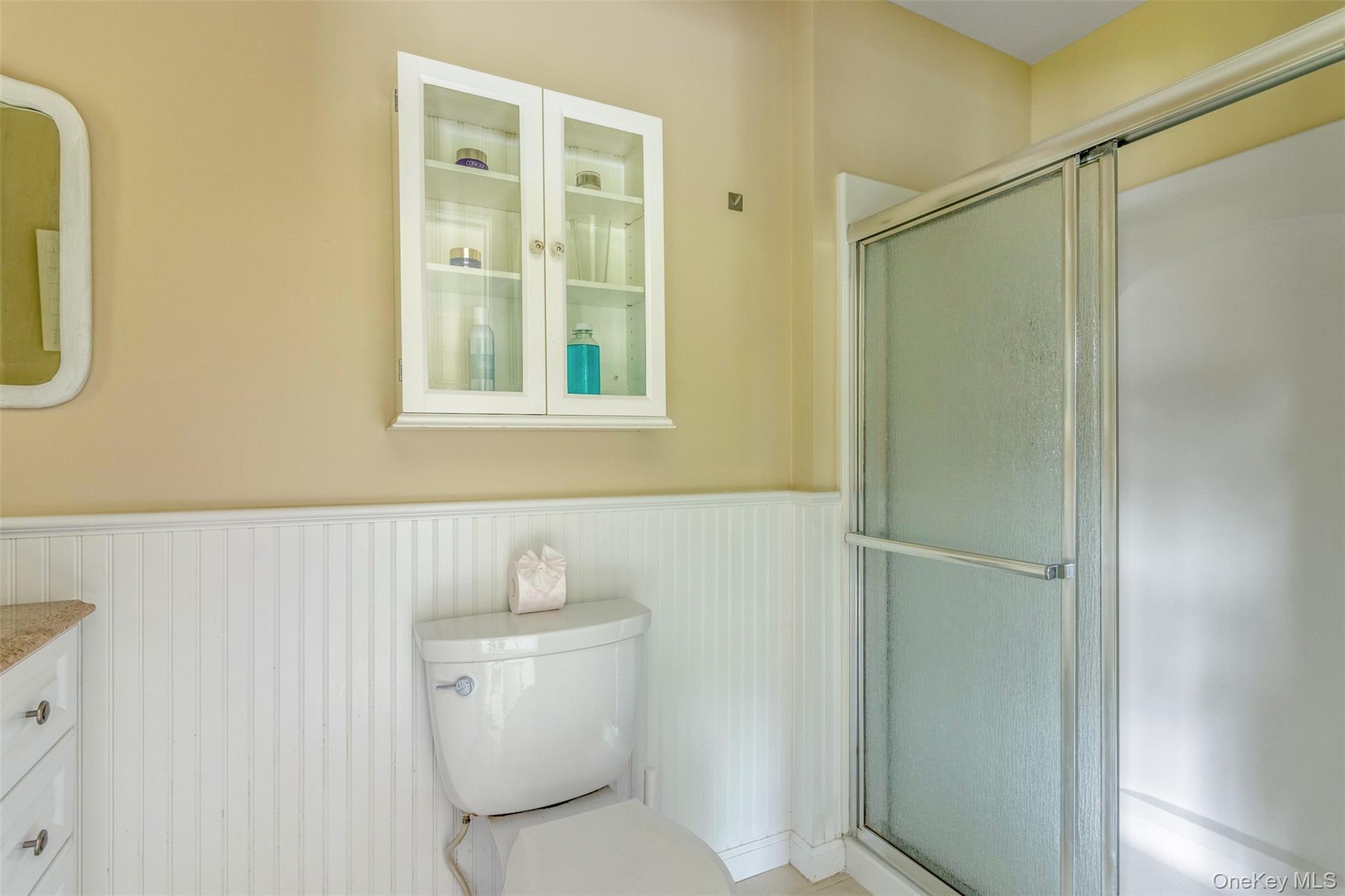 315 Wicks Road New Suffolk, NY 11956 - Photo 16 of 28 a bathroom with a toilet and a shower