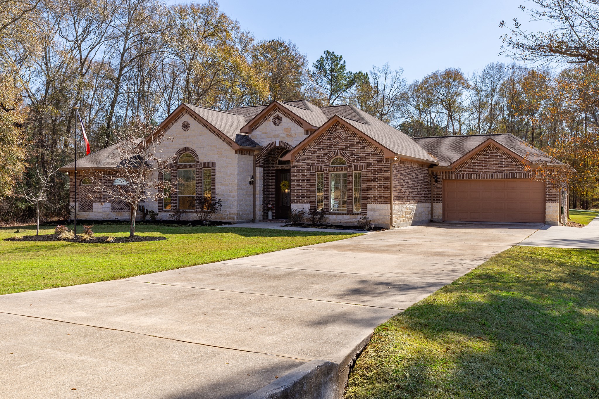 27688 Rio Blanco Drive Splendora, TX 77372 - Photo 39 of 50 a front view of a house with a yard and trees