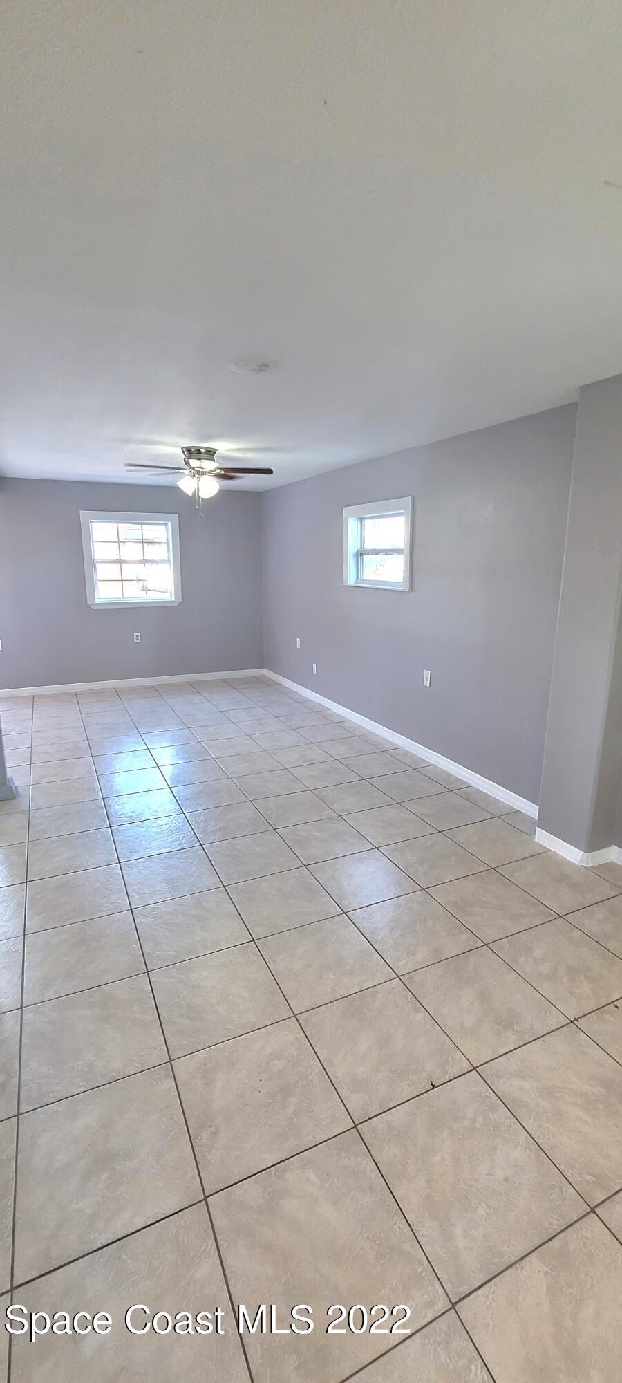 802 Forrest Avenue, Unit A Cocoa, FL 32922 - Photo 6 of 16 a view of an empty room and window