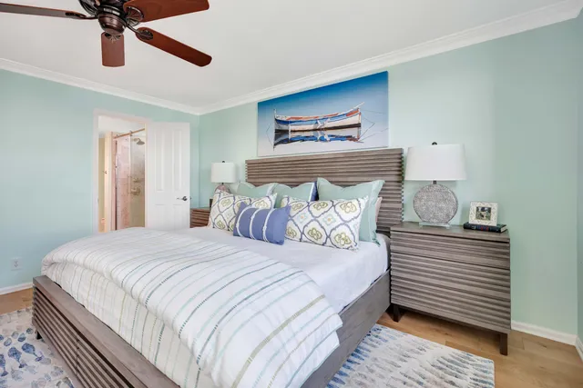 a bedroom with a bed and ceiling fan