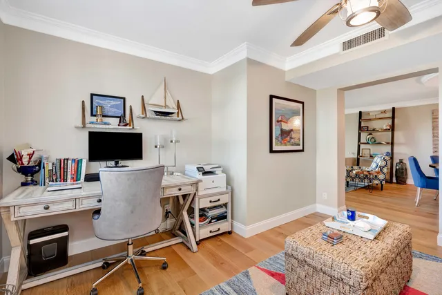 a workspace with furniture and wooden floor