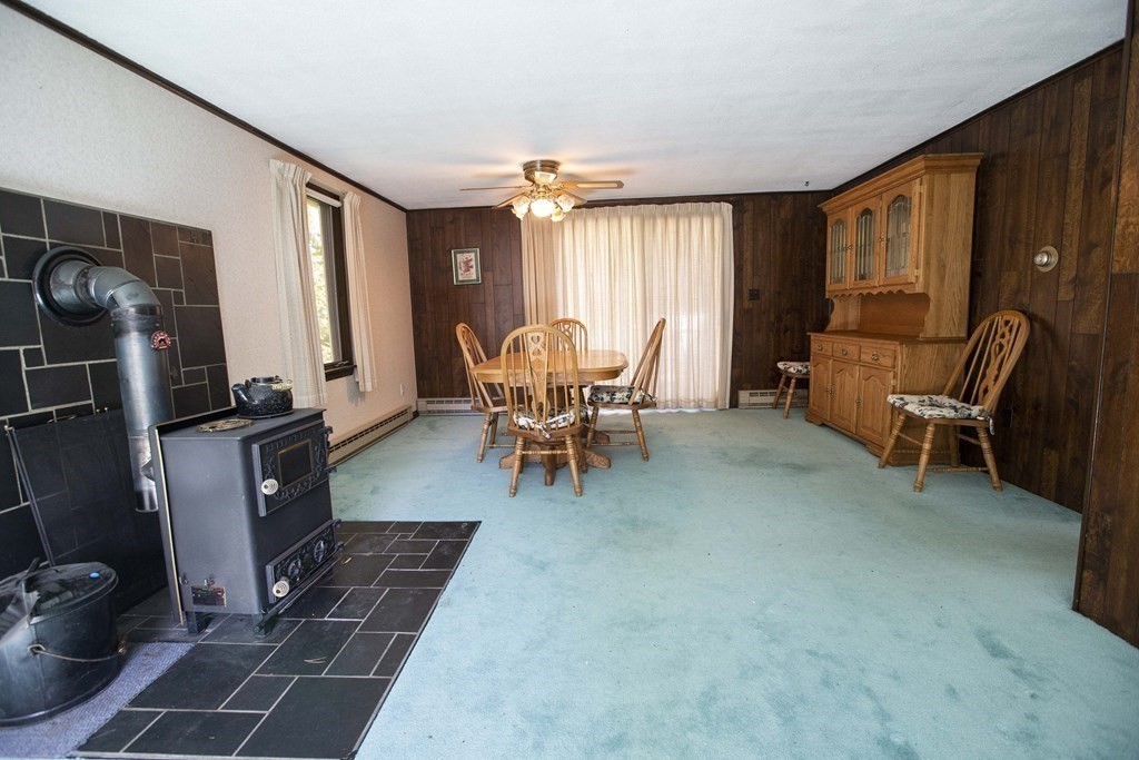 69 Sturges Road Reading, MA 01867 - Photo 18 of 42 a dining room with furniture and a window
