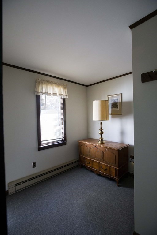 69 Sturges Road Reading, MA 01867 - Photo 22 of 42 a bed room with furniture and a window