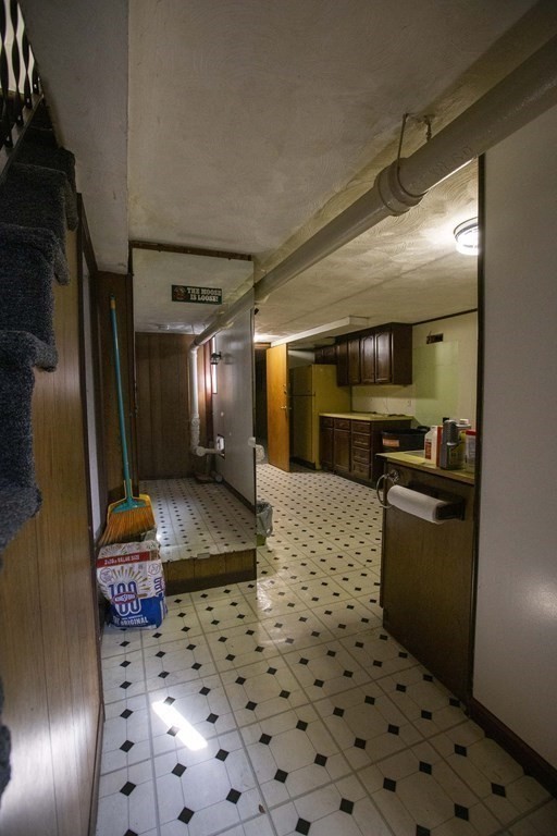69 Sturges Road Reading, MA 01867 - Photo 23 of 42 a kitchen with granite countertop a refrigerator and a stove