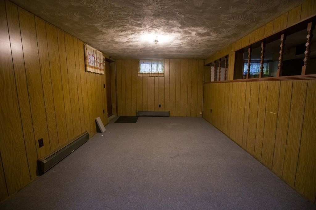69 Sturges Road Reading, MA 01867 - Photo 28 of 42 a view of an empty room with windows