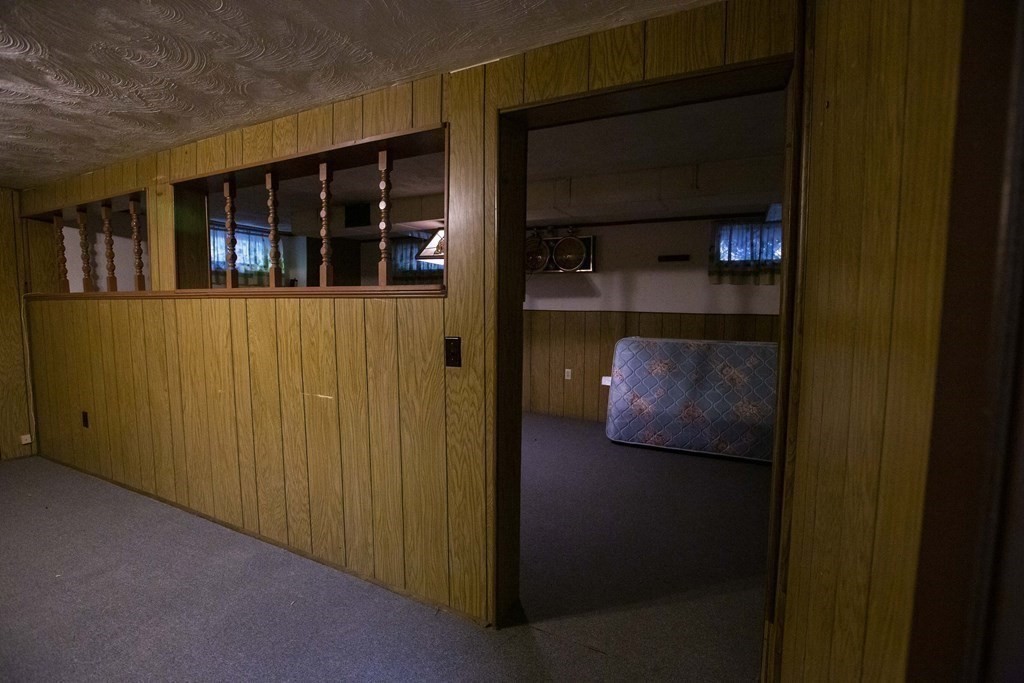 69 Sturges Road Reading, MA 01867 - Photo 30 of 42 a hallway with two glass windows
