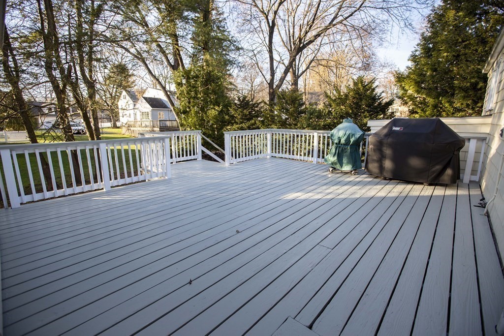 69 Sturges Road Reading, MA 01867 - Photo 33 of 42 a view of deck with wooden floor and outdoor seating
