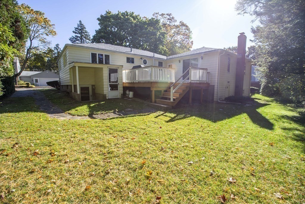 69 Sturges Road Reading, MA 01867 - Photo 34 of 42 a view of a back yard of the house