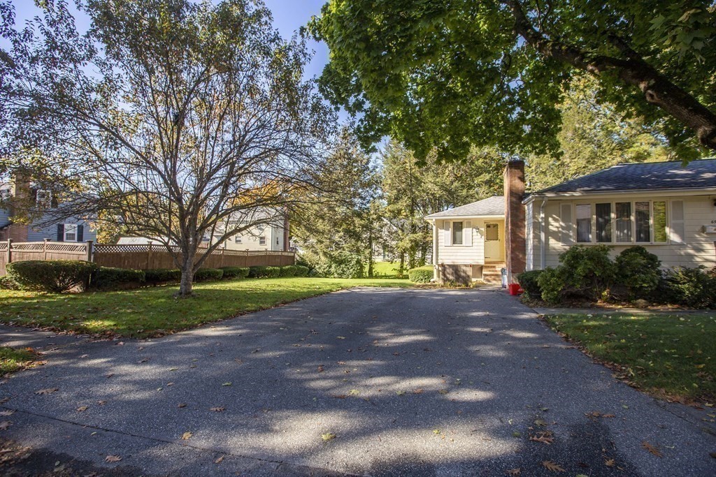 69 Sturges Road Reading, MA 01867 - Photo 39 of 42 a view of a house with a street