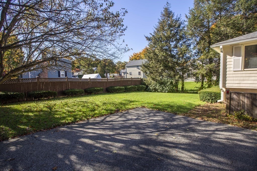 69 Sturges Road Reading, MA 01867 - Photo 40 of 42 a view of a house with a yard