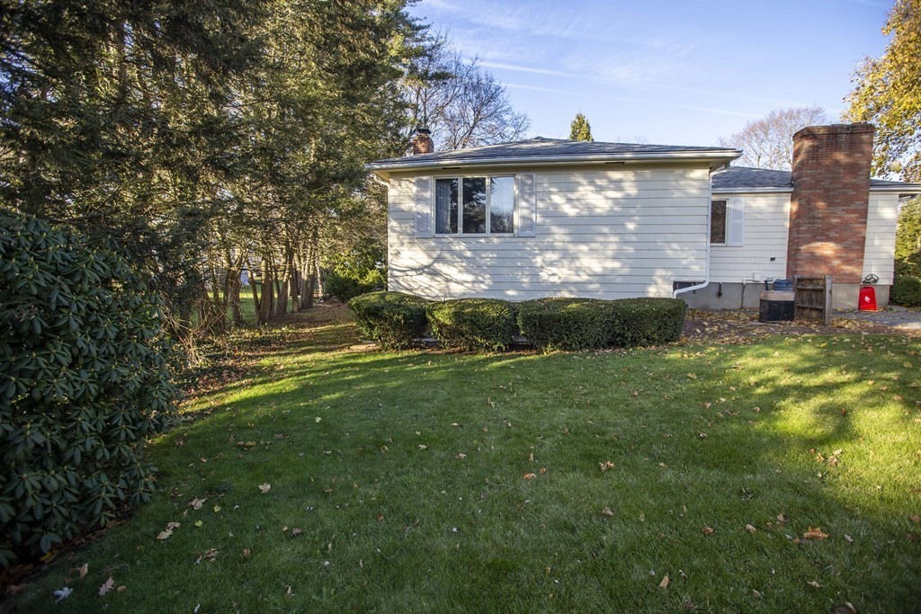 69 Sturges Road Reading, MA 01867 - Photo 41 of 42 a view of house with backyard