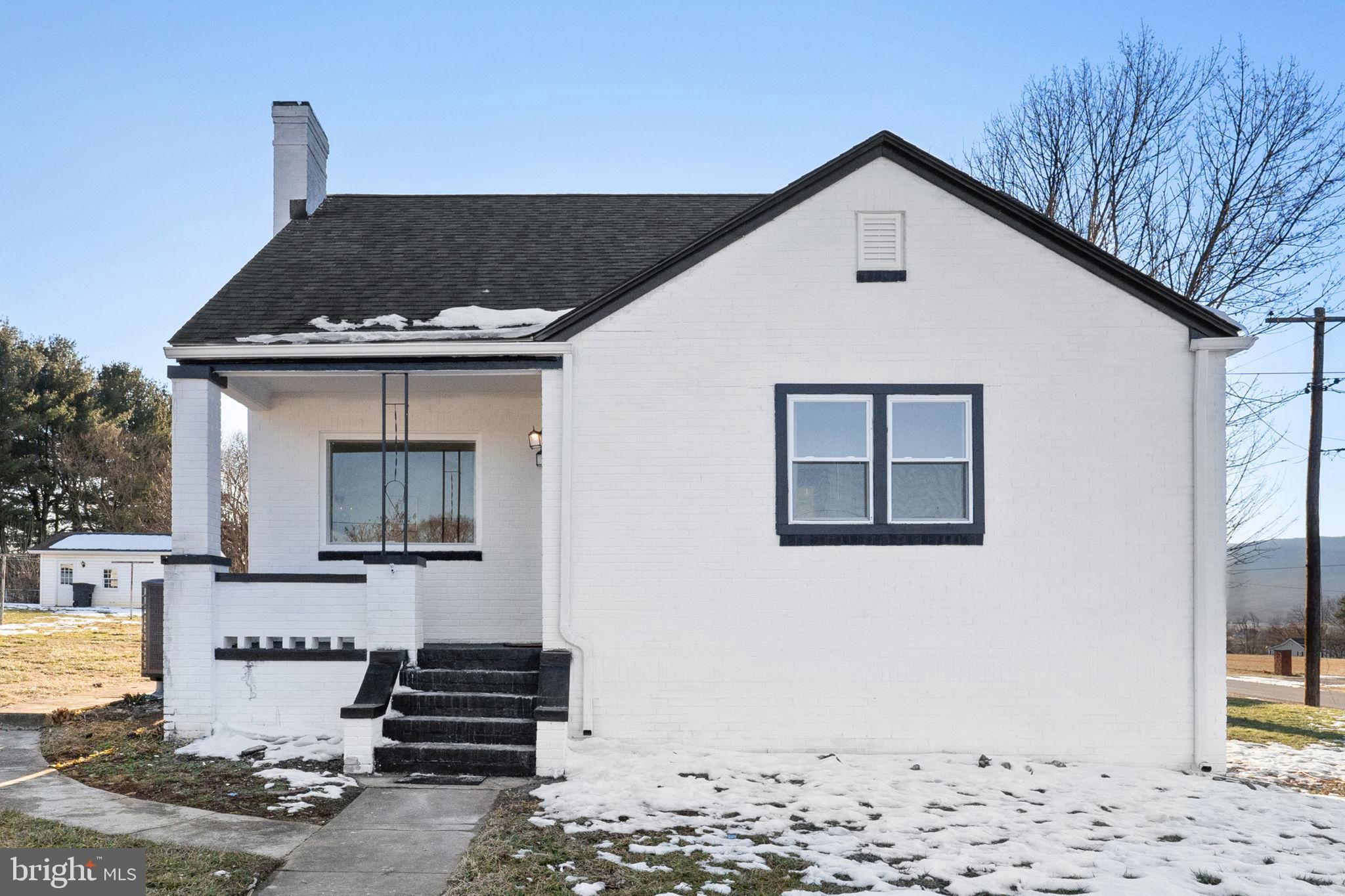 701 South 2nd Street Shenandoah, VA 22849 - Photo 6 of 39 Charming white cottage with scenic backdrop.