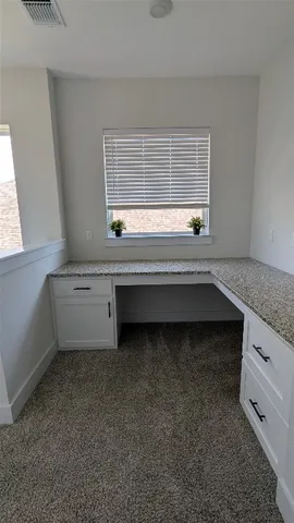 a view of cabinets and window