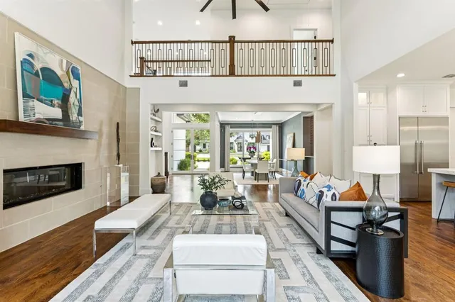 a living room with furniture and kitchen view