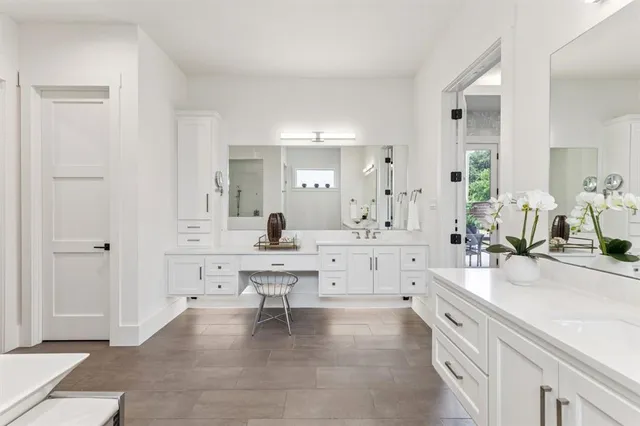 a spacious bedroom with a bed and a shower