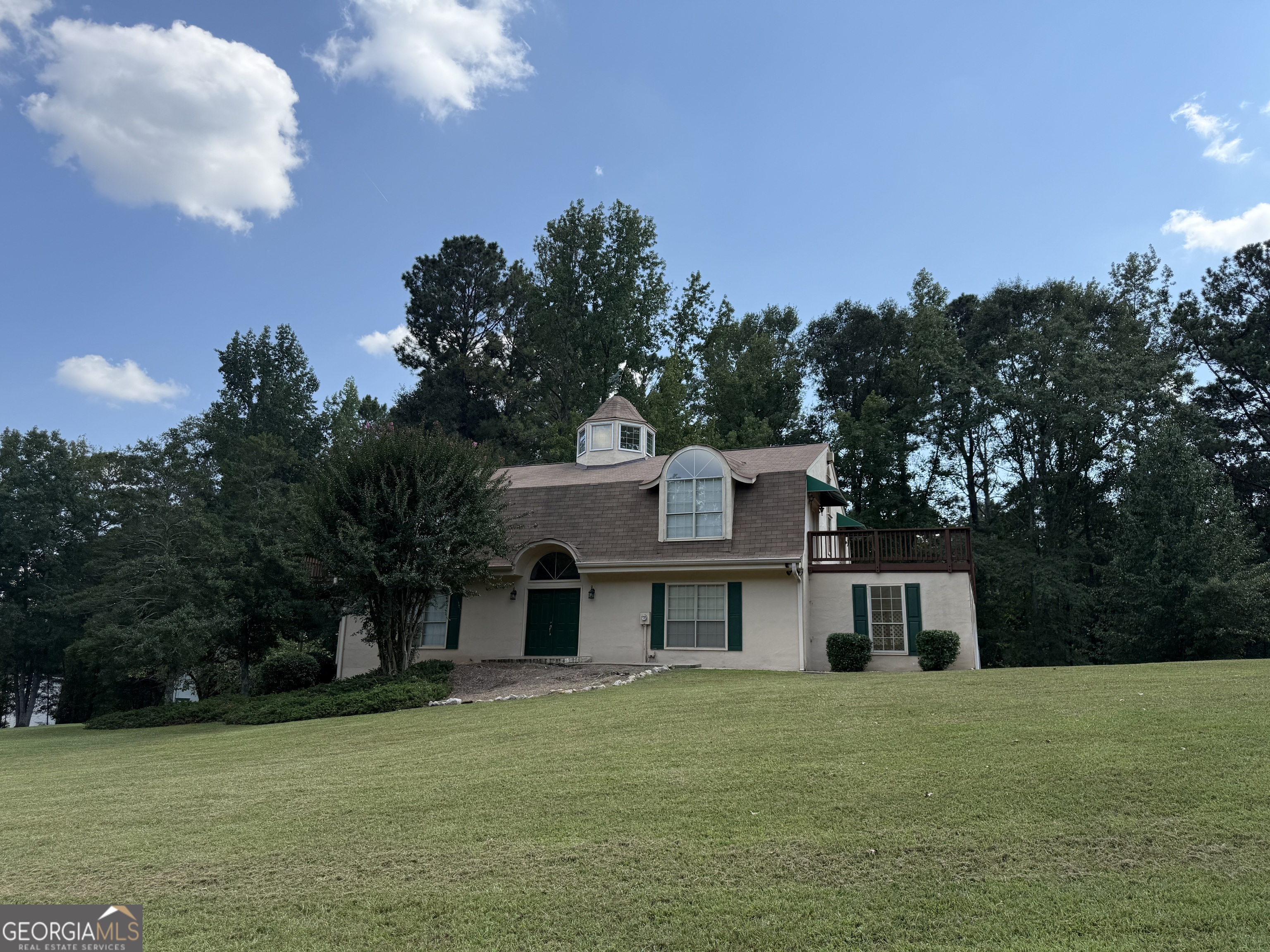 242 Ebenezer Church Road Fayetteville, GA 30215 - Photo 2 of 46 a house view with a garden space