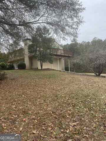 242 Ebenezer Church Road Fayetteville, GA 30215 - Photo 45 of 46 a front view of a house with a yard