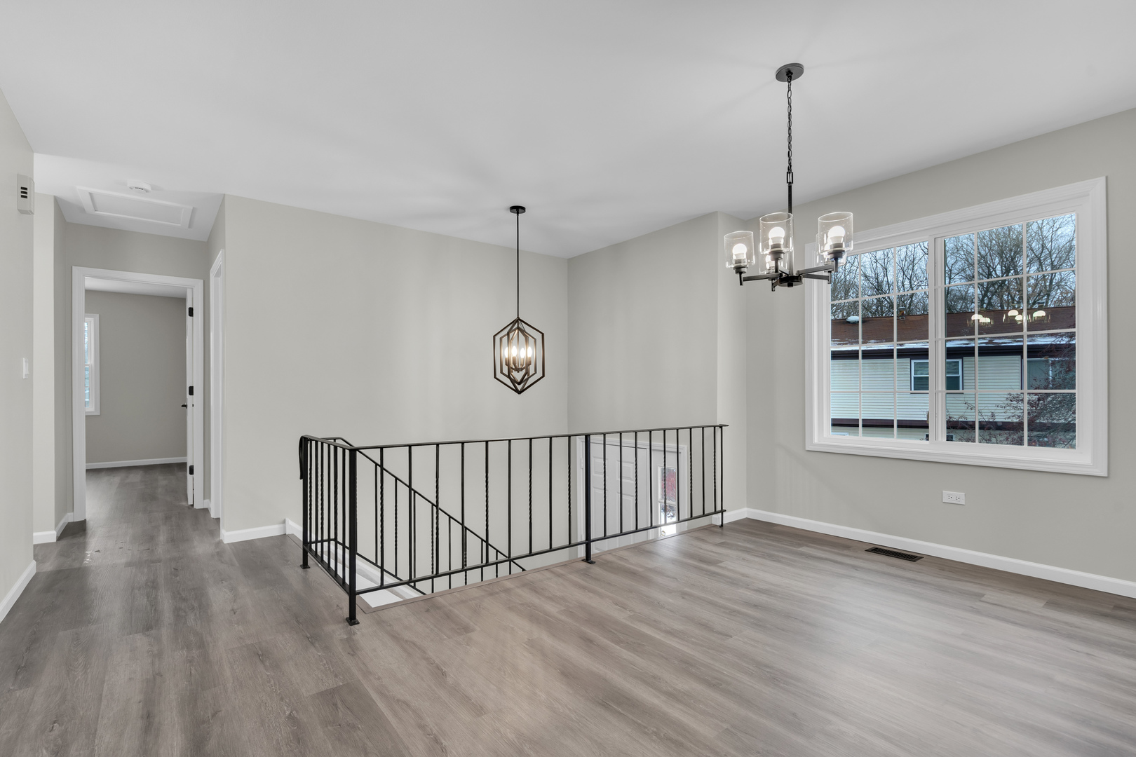86 Silver Tree Circle Cary, IL 60013 - Photo 11 of 26 a view of a room with wooden floor chandelier and windows