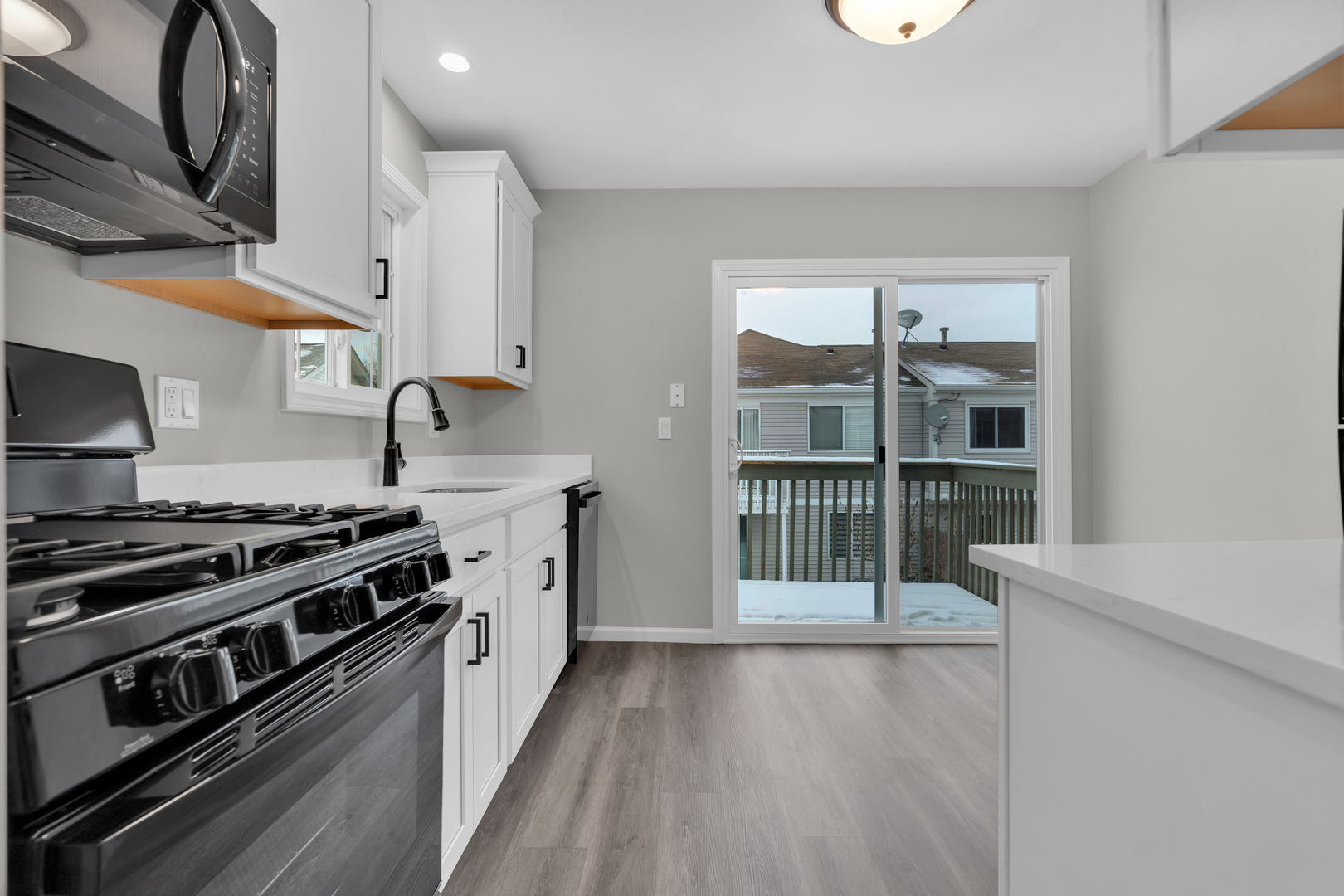 86 Silver Tree Circle Cary, IL 60013 - Photo 12 of 26 a kitchen with a stove and a wooden floors
