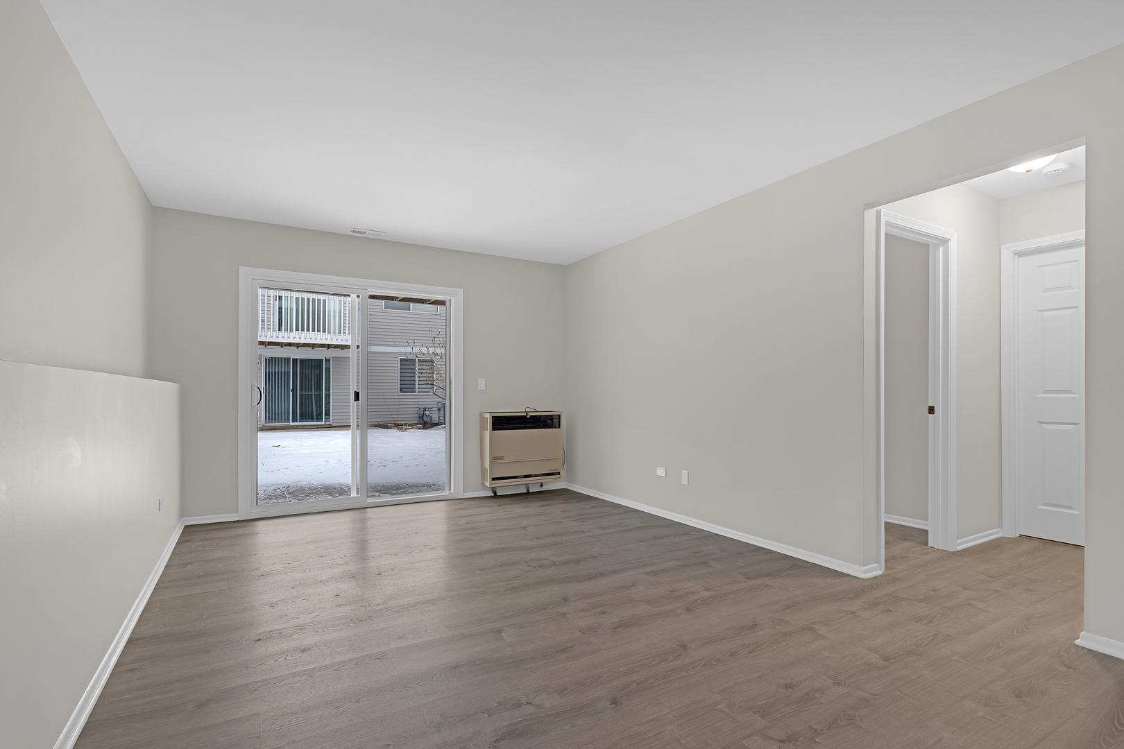 86 Silver Tree Circle Cary, IL 60013 - Photo 18 of 26 a view of an empty room and window with wooden floor