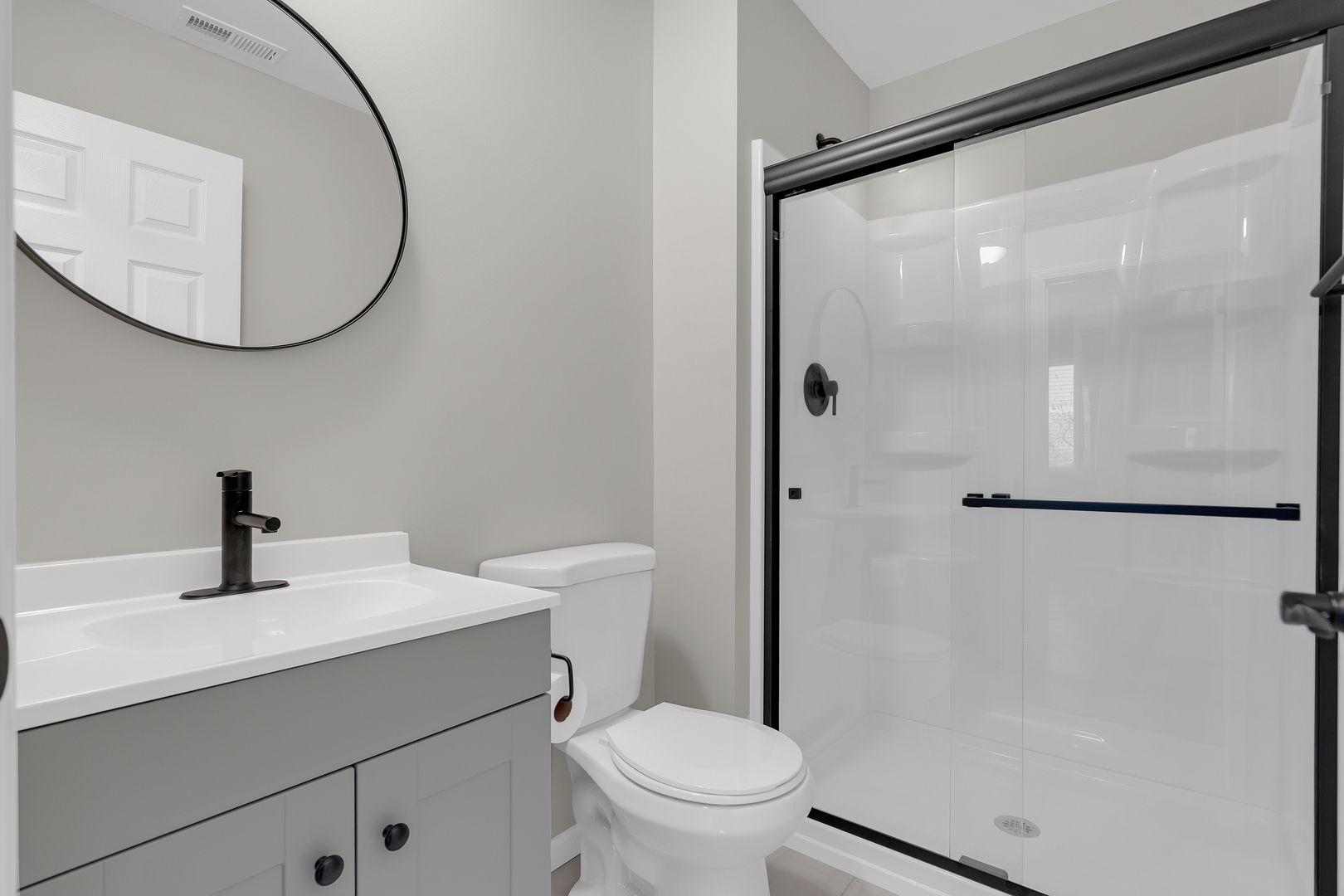 86 Silver Tree Circle Cary, IL 60013 - Photo 21 of 26 a bathroom with a sink a toilet and a mirror
