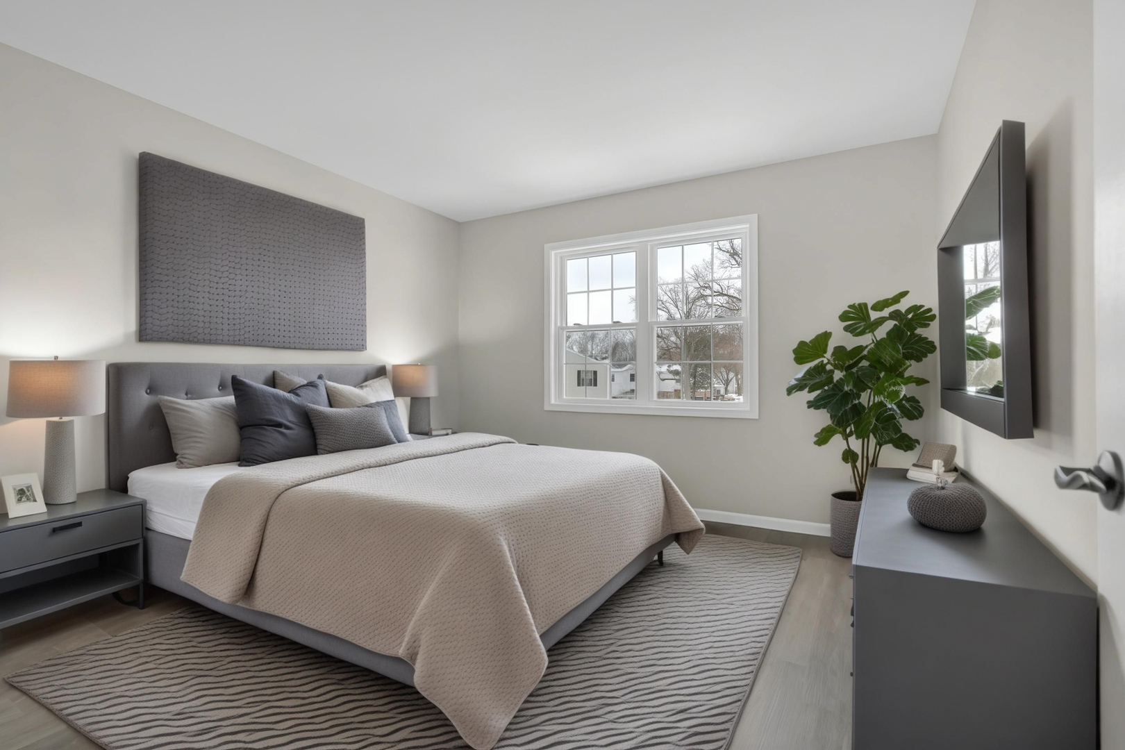 86 Silver Tree Circle Cary, IL 60013 - Photo 4 of 26 a bedroom with double bed and a potted plant