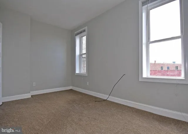 an empty room with windows