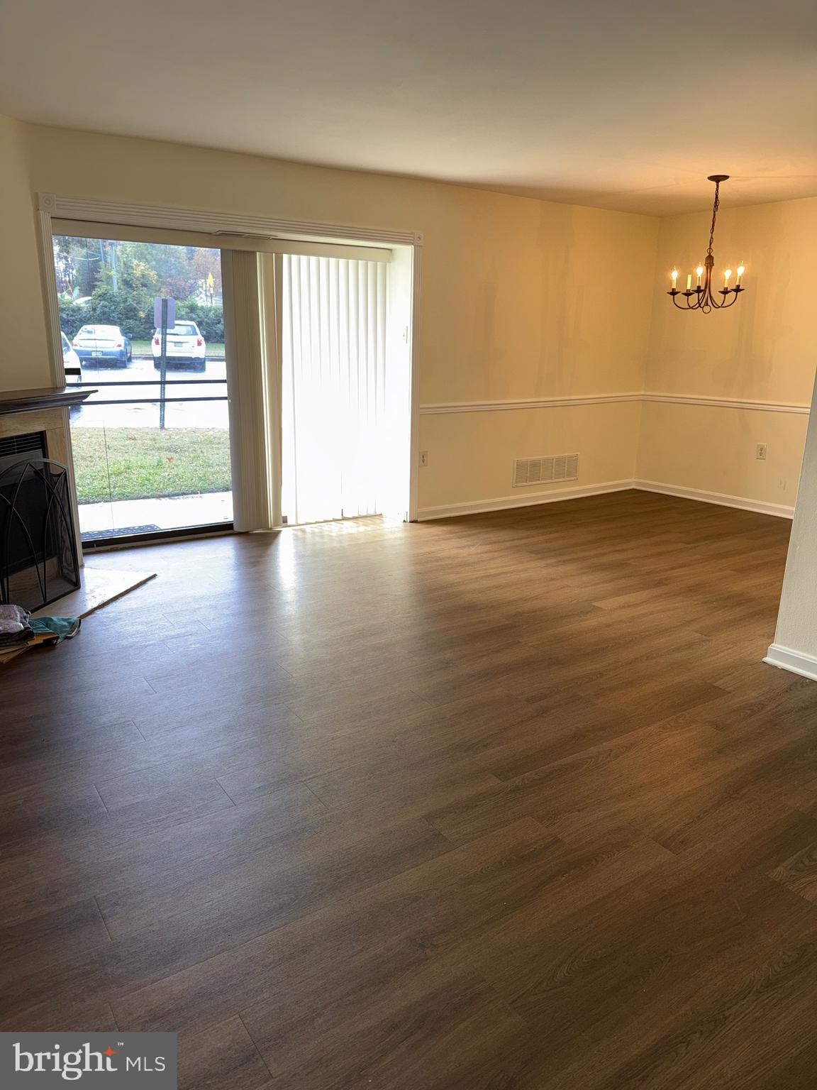 118 Mountain Road, Unit 1A Glen Burnie, MD 21060 - Photo 11 of 16 an empty room with wooden floor and windows