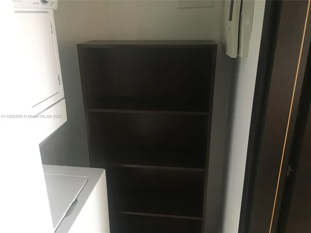 a kitchen with a cabinets and steel stainless steel appliances