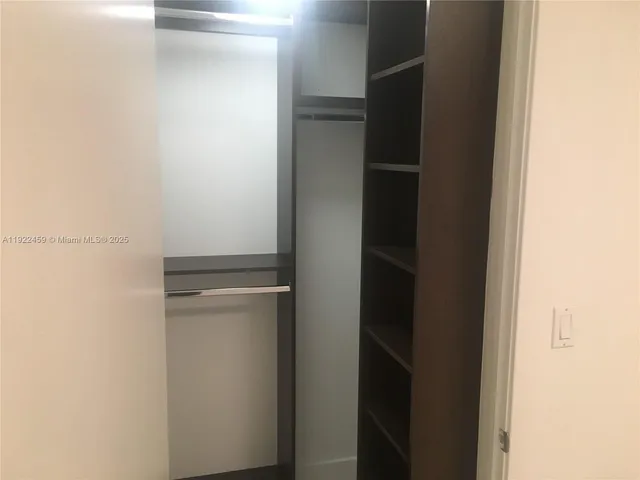 a bathroom with a sink toilet and a mirror