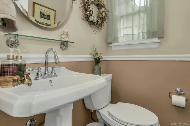 a kitchen with stainless steel appliances granite countertop a stove top oven a sink dishwasher a dining table and chairs with wooden cabinets