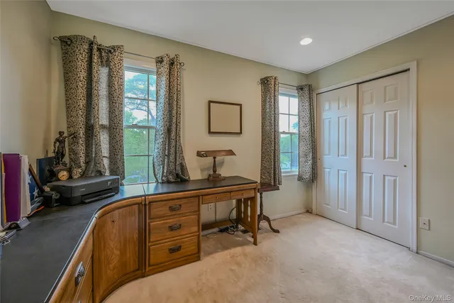 a kitchen with a refrigerator and a stove top oven