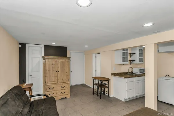 a kitchen with a refrigerator and a stove top oven