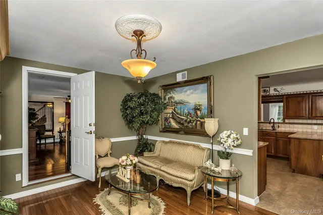 a kitchen with stainless steel appliances granite countertop a stove top oven a refrigerator and a microwave