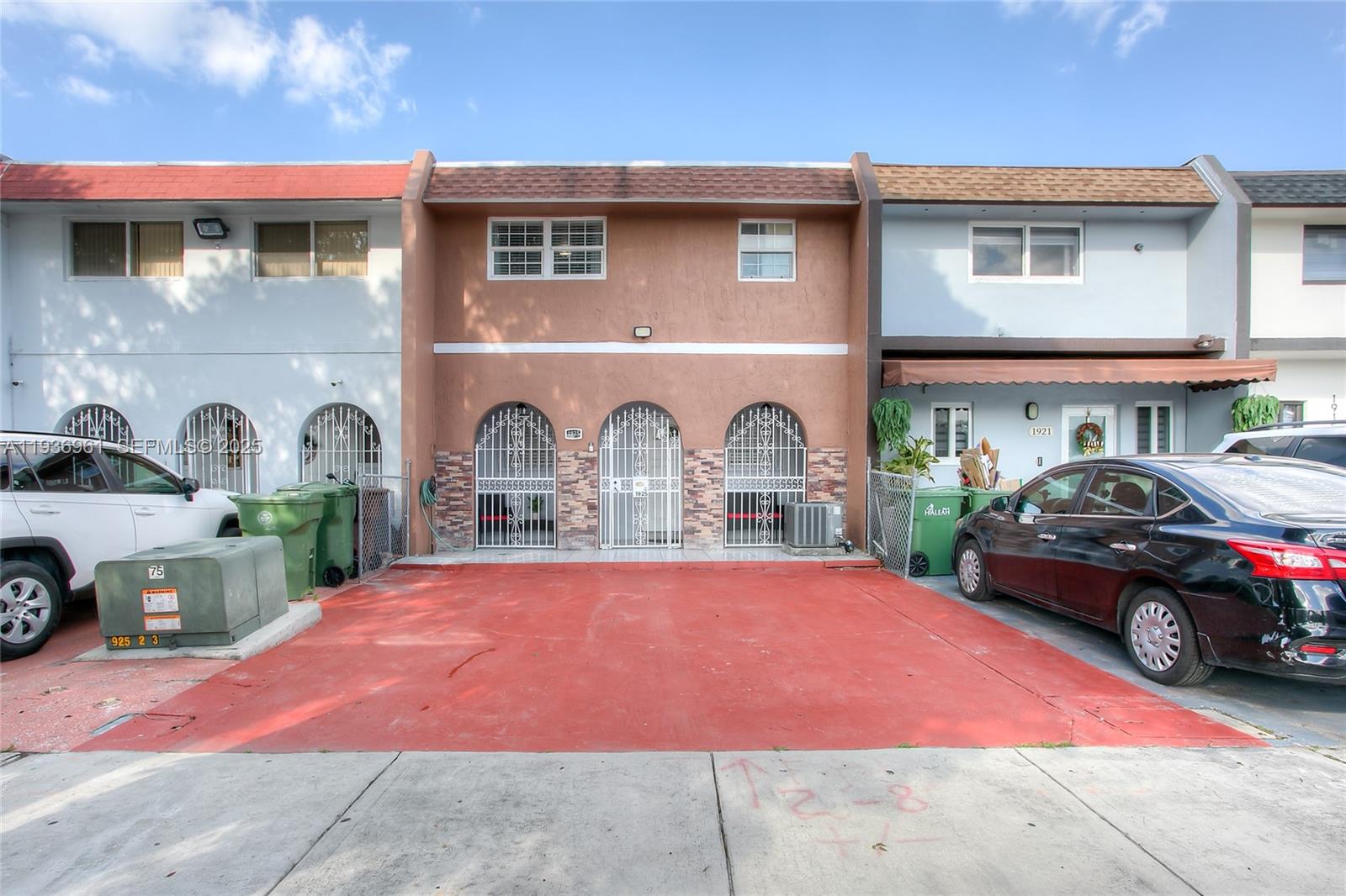 1925 West 72nd Street Hialeah, FL 33014 - Photo 1 of 15 a front view of a house with parking space