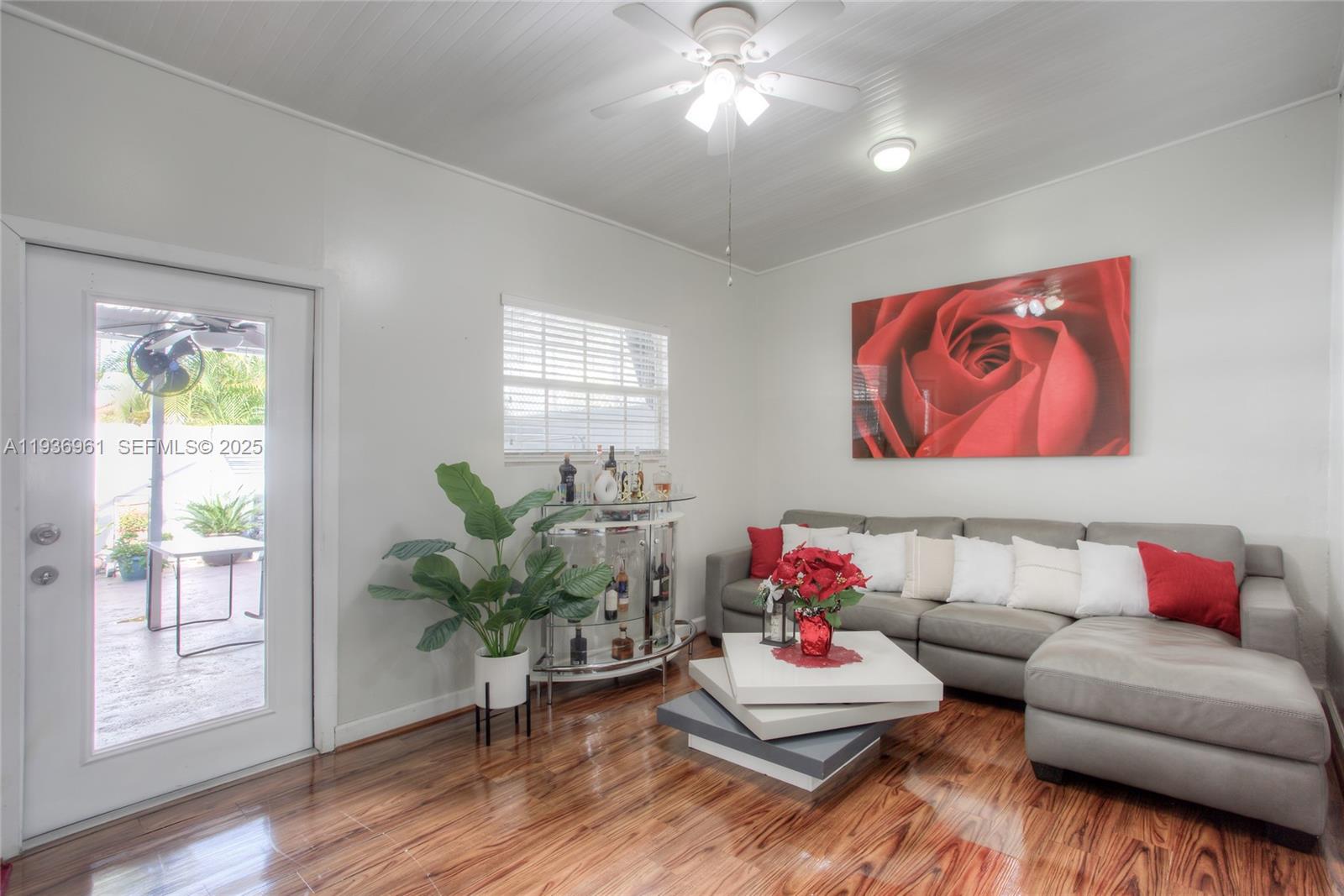 1925 West 72nd Street Hialeah, FL 33014 - Photo 13 of 15 a living room with furniture and a potted plant