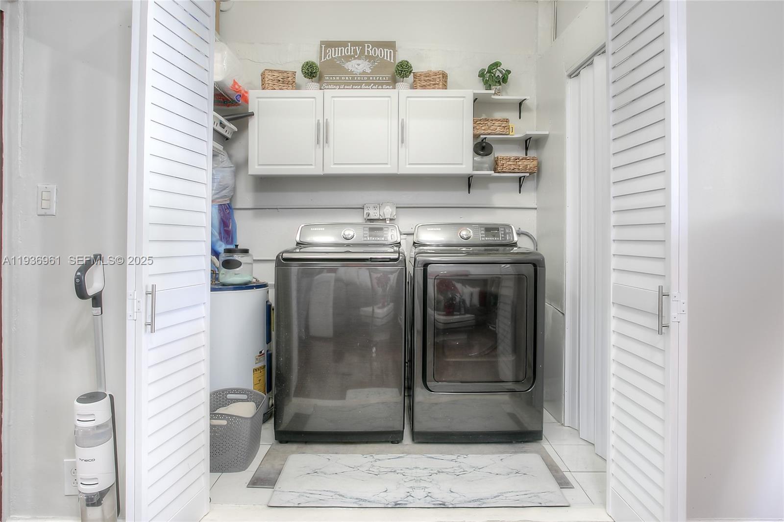 1925 West 72nd Street Hialeah, FL 33014 - Photo 14 of 15 a view of a hallway with washer and dryer