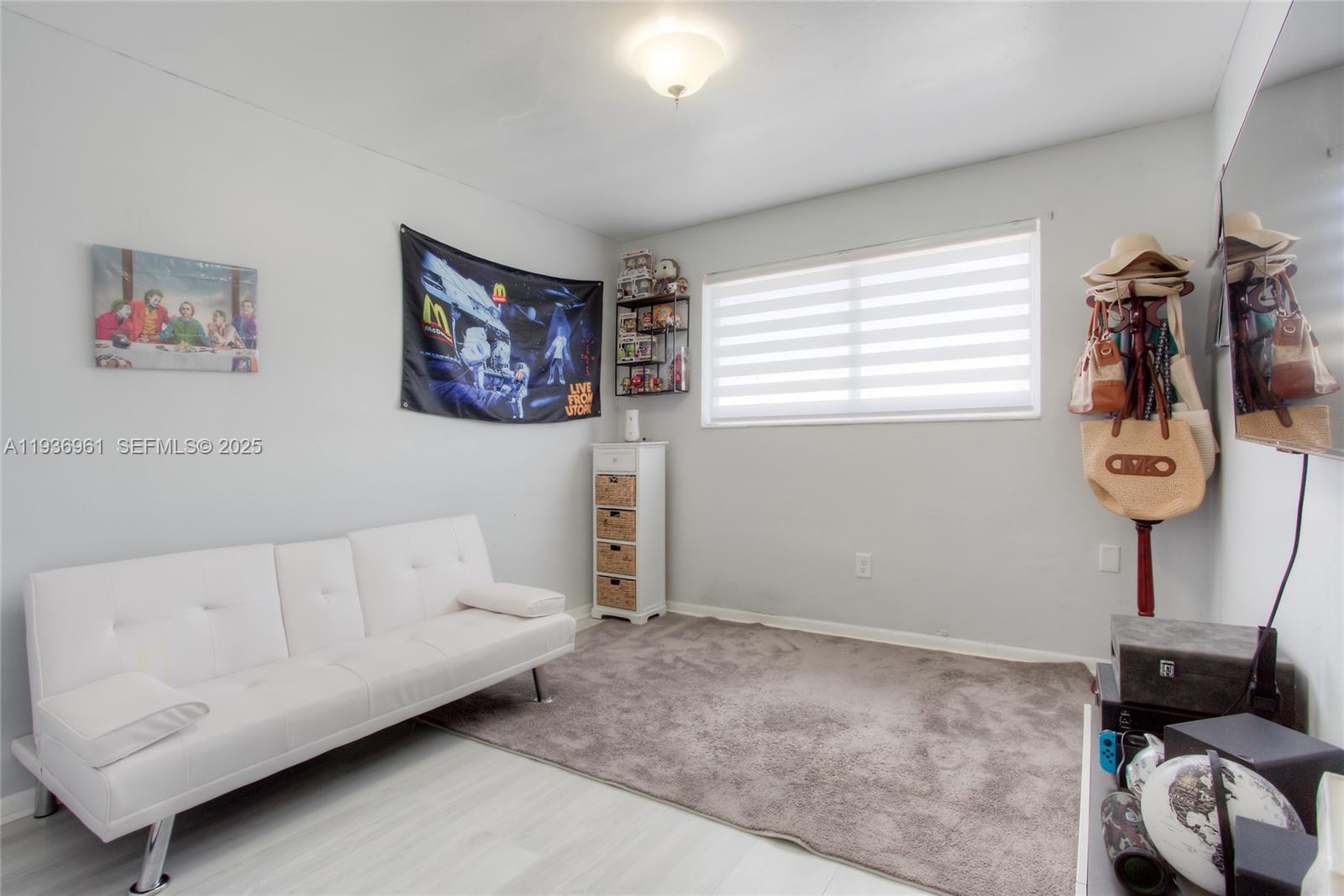 1925 West 72nd Street Hialeah, FL 33014 - Photo 10 of 15 a living room with furniture and a window