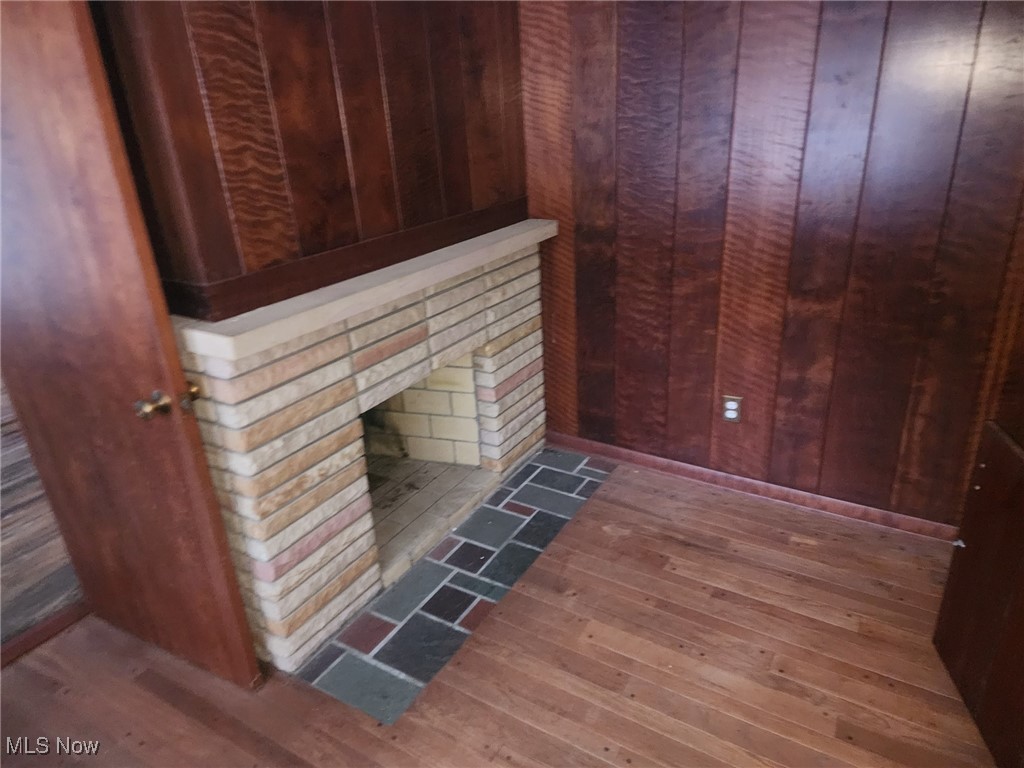 7516 Mayfield Road Chesterland, OH 44026 - Photo 14 of 21 Interior details featuring a sauna, wood finished floors, and wood walls